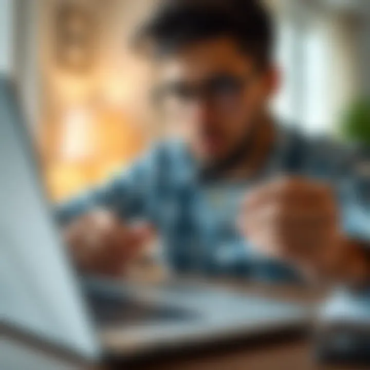 Analyzing Credit Card Features A person analyzing credit card features on a laptop.